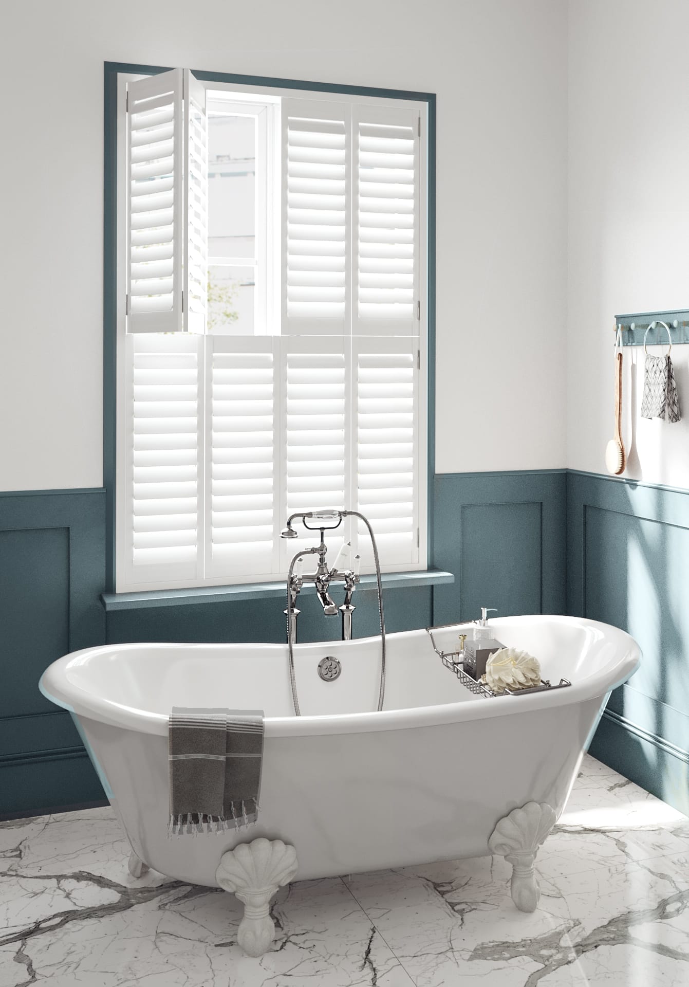 Tier-on-tier white plantation shutters in a stylish teal bathroom, demonstrating independent top and bottom panels for privacy and light control.