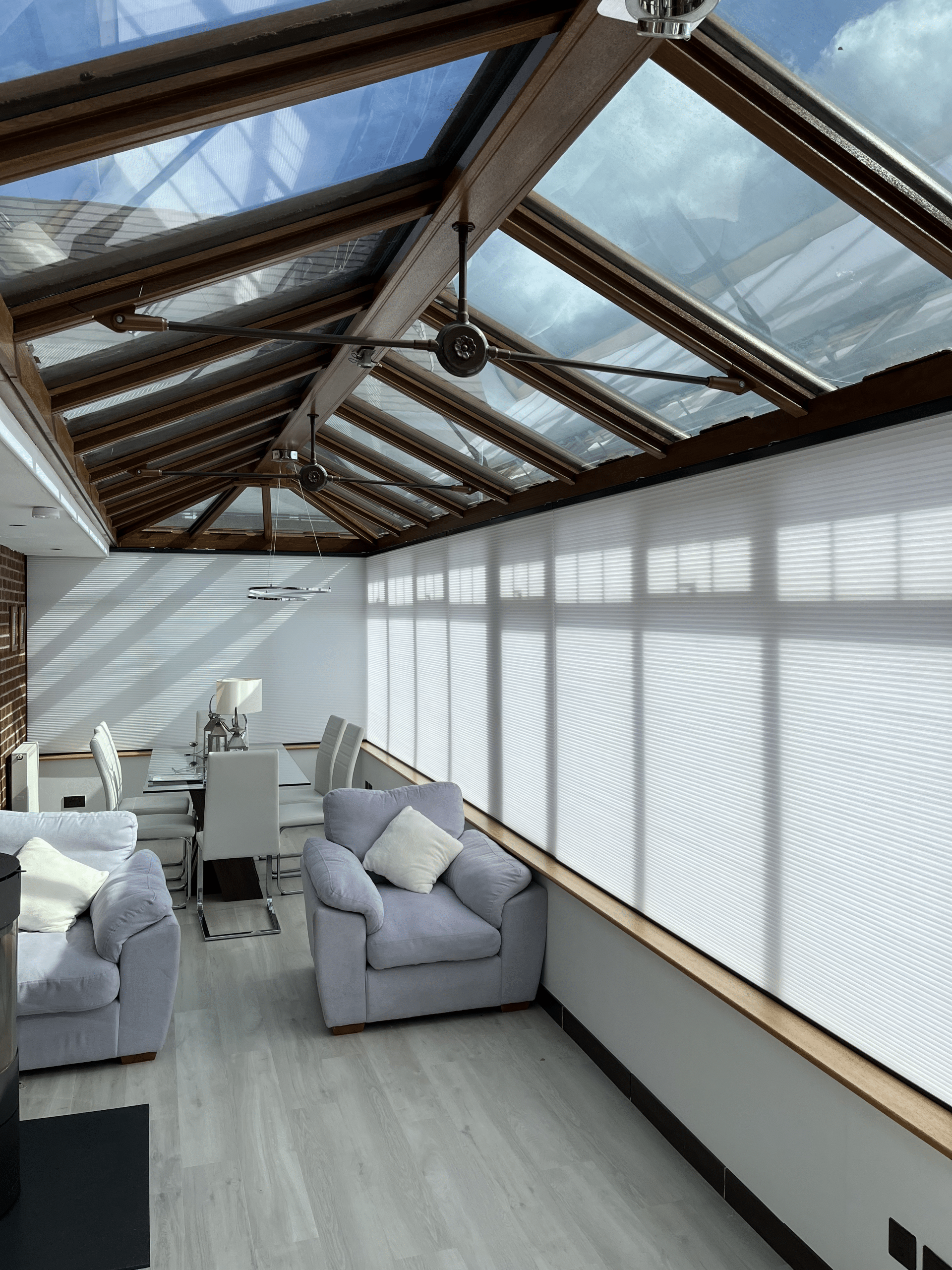 Electric thermal conservatory blinds installed in a modern glass conservatory in Newton Mearns Glasgow