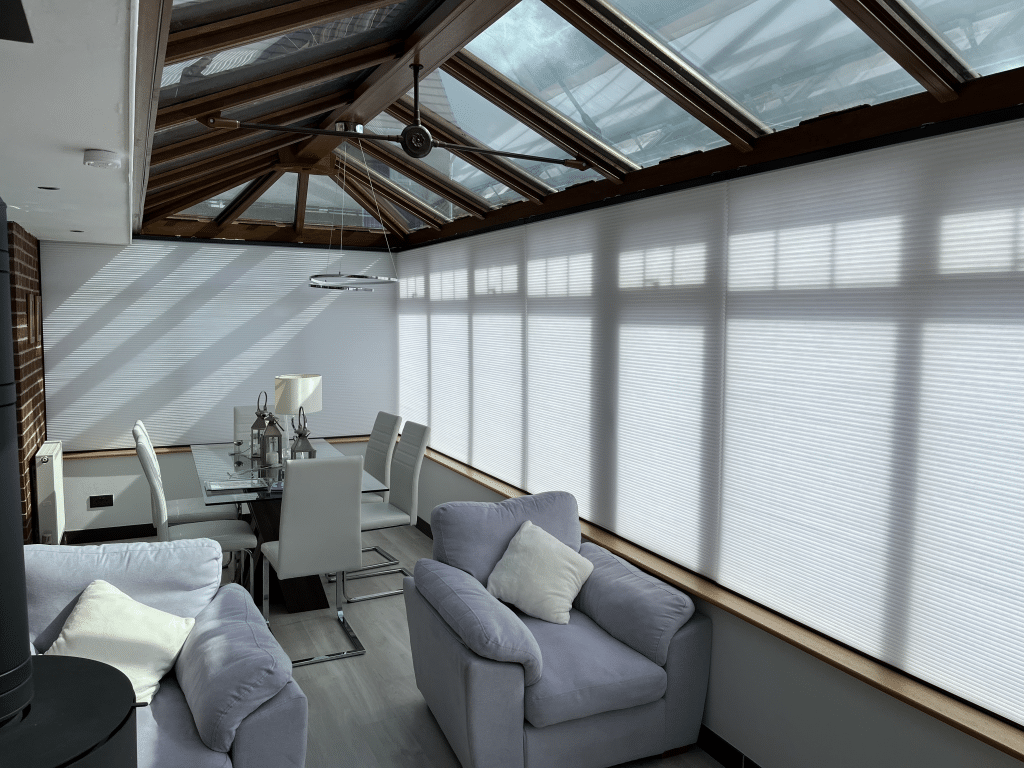 Electric thermal conservatory blinds installed in a modern glass conservatory in Newton Mearns Glasgow
